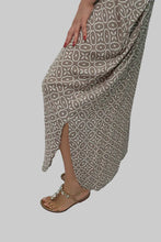 Load image into Gallery viewer, Long patterned skirt worn by a person on a plain background