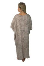 Load image into Gallery viewer, Woman wearing a patterned long dress against a plain background