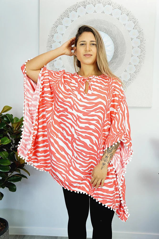 Coral Zebra print kaftan top with Pom Poms.  One size fits all.